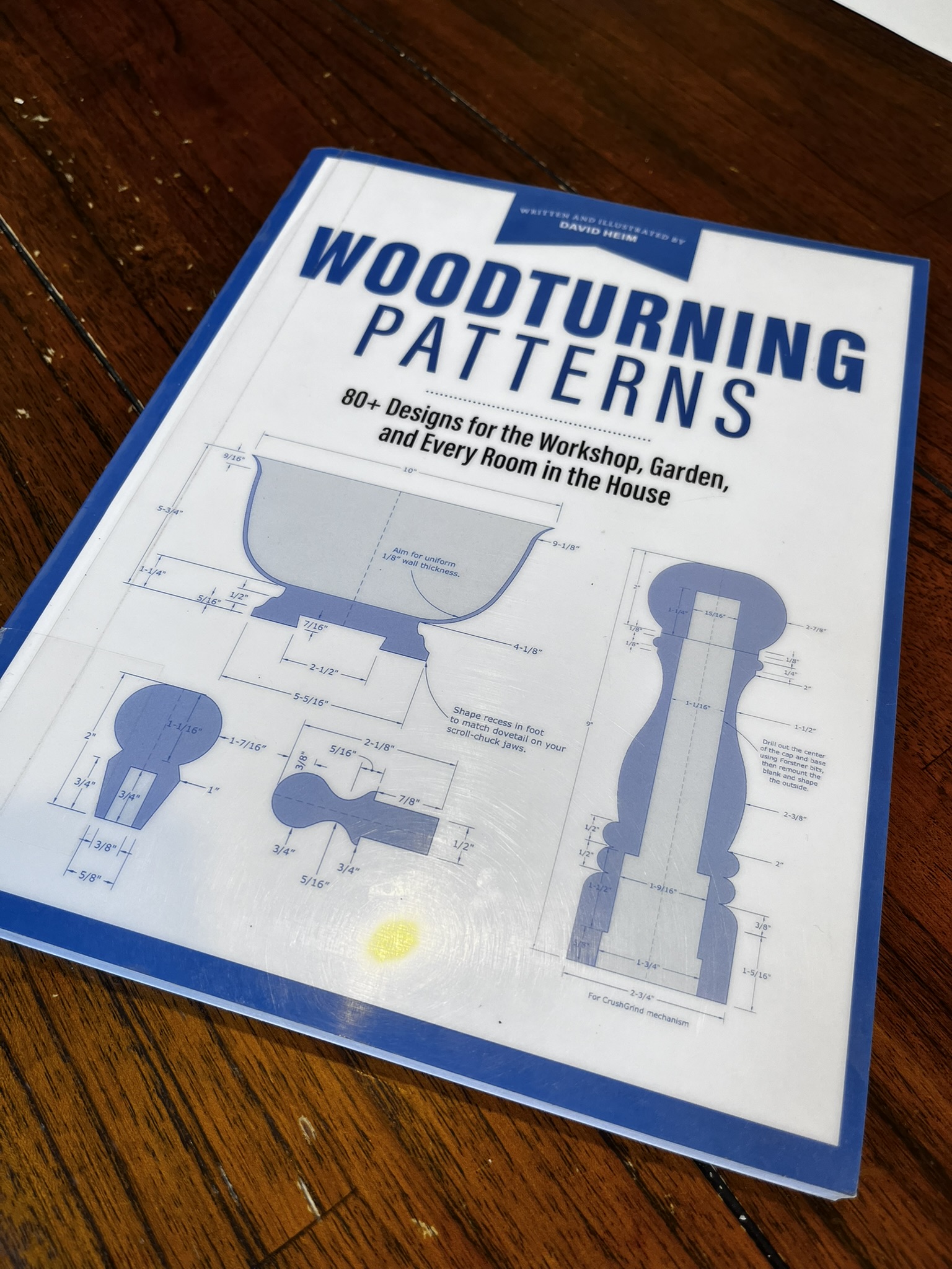 A copy of woodturning patterns book on a wooden table